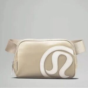 lululemon Everywhere Belt Bag 1L with a raised logo in the Trench/White Opal